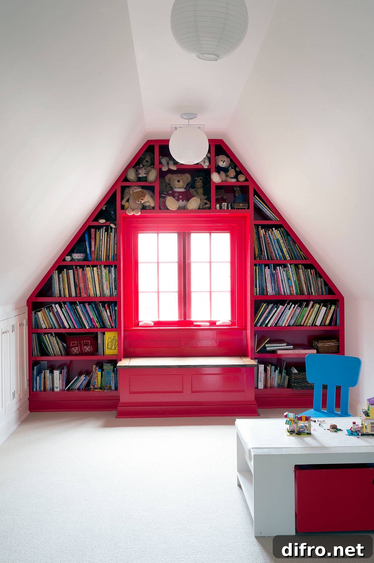 Custom bookshelf and storage in contemporary attic playroom