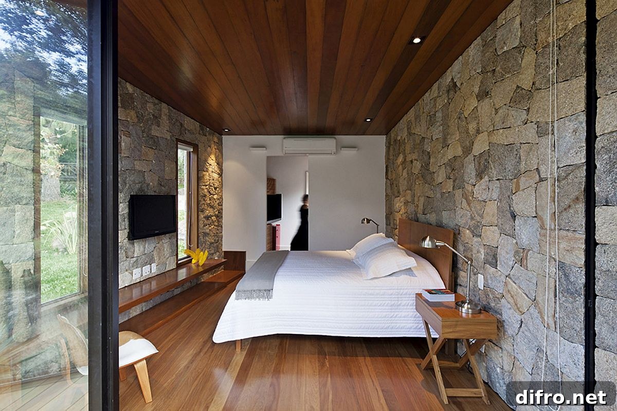 Retreat bedroom with stone walls and wooden flooring
