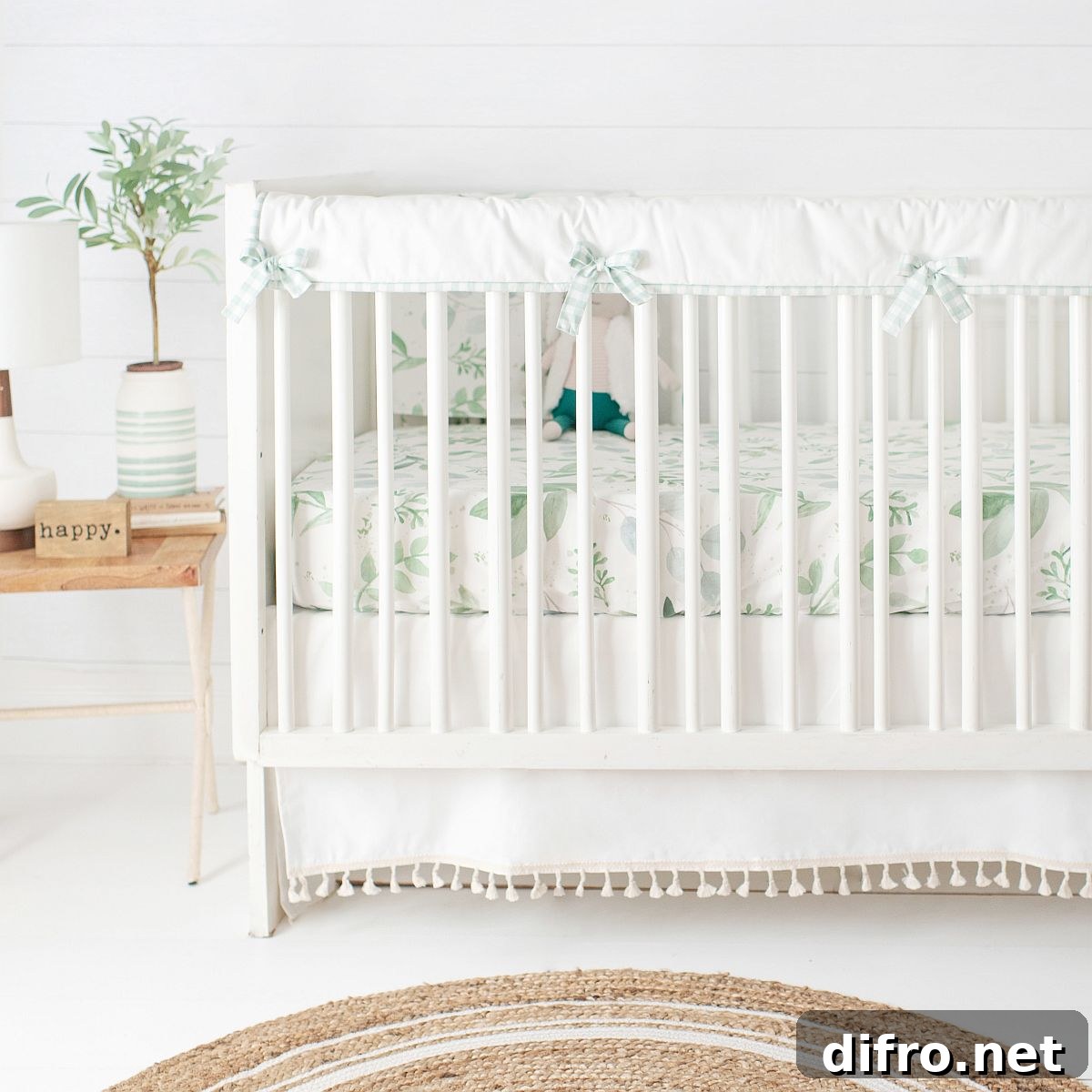 Simple crib in white and wood in farmhouse nursery