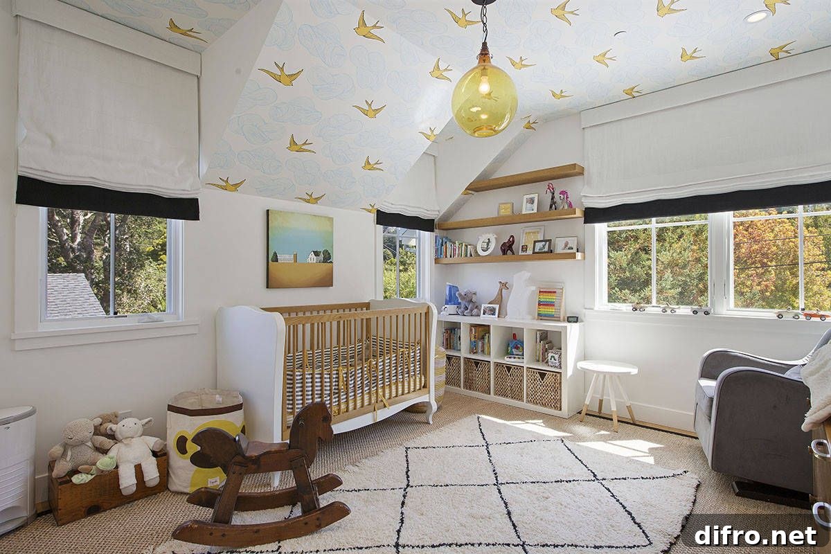 Gender-neutral farmhouse nursery in white with patterned wallpaper