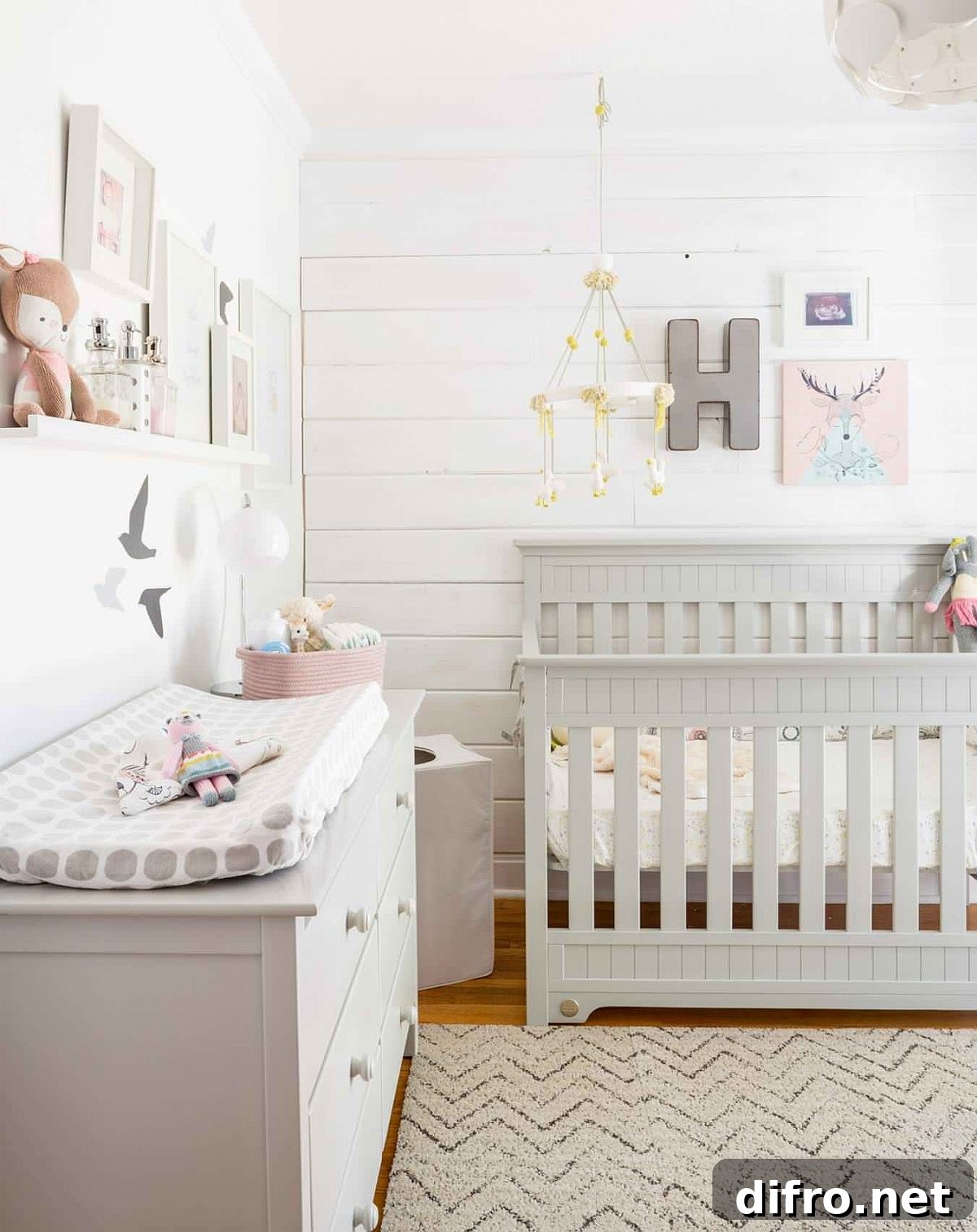Girls' nursery in white and wood with modern touches