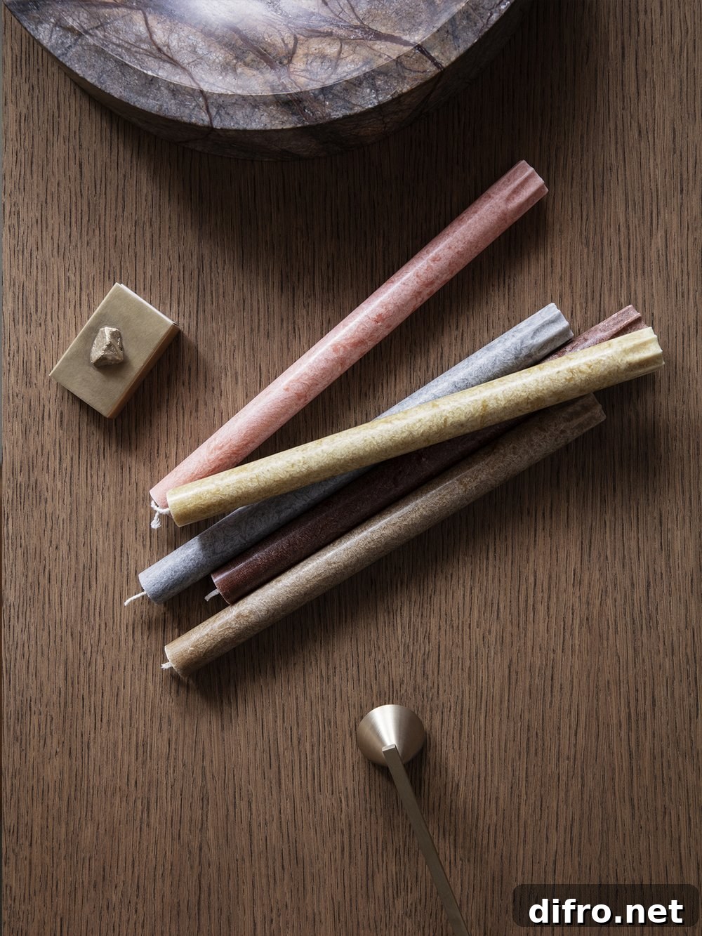 Textured candles arranged on a tray