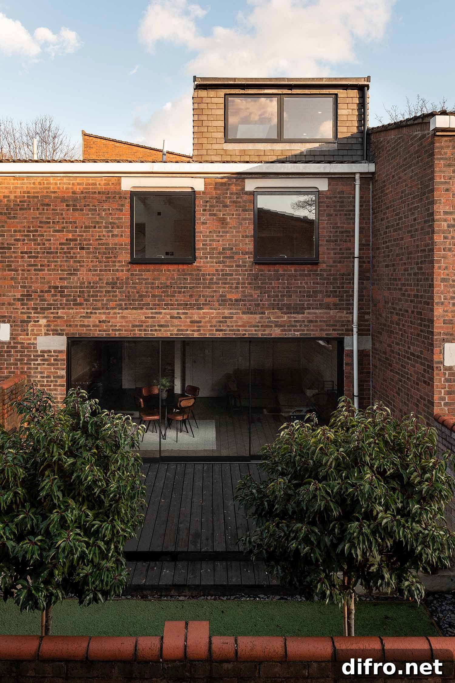 Facade of the London home showing brick and glass elements
