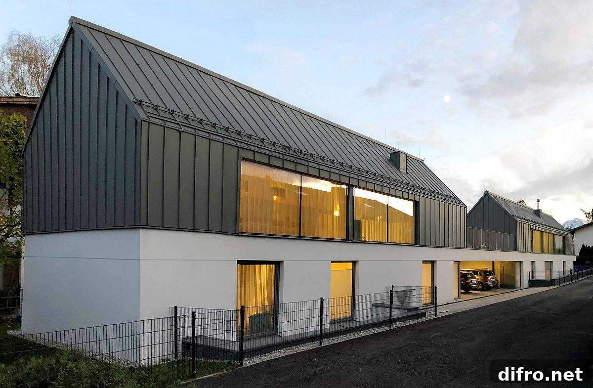 Exterior combining gray modernity with classic gable roofs