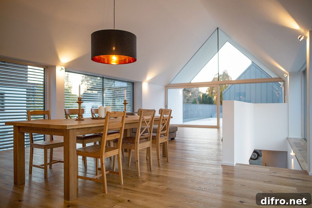 Large black pendant light above the dining table