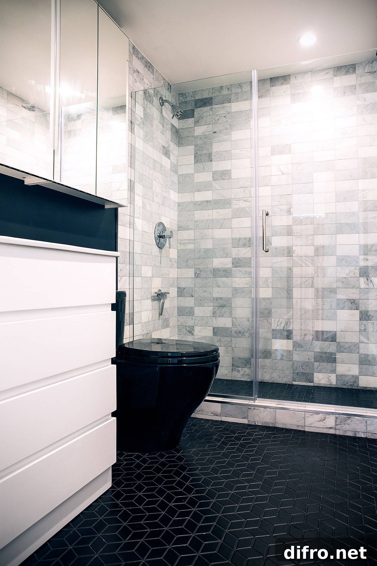 Bathroom featuring patterned black tiles on the floor