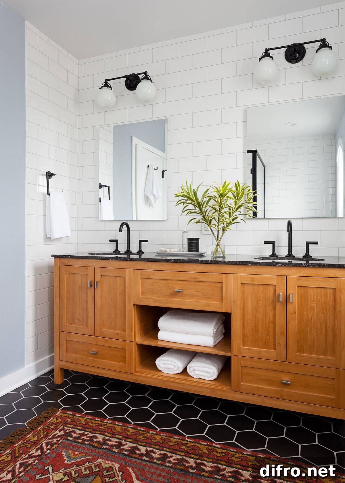 Black and white bathroom with wooden vanity and dark floor