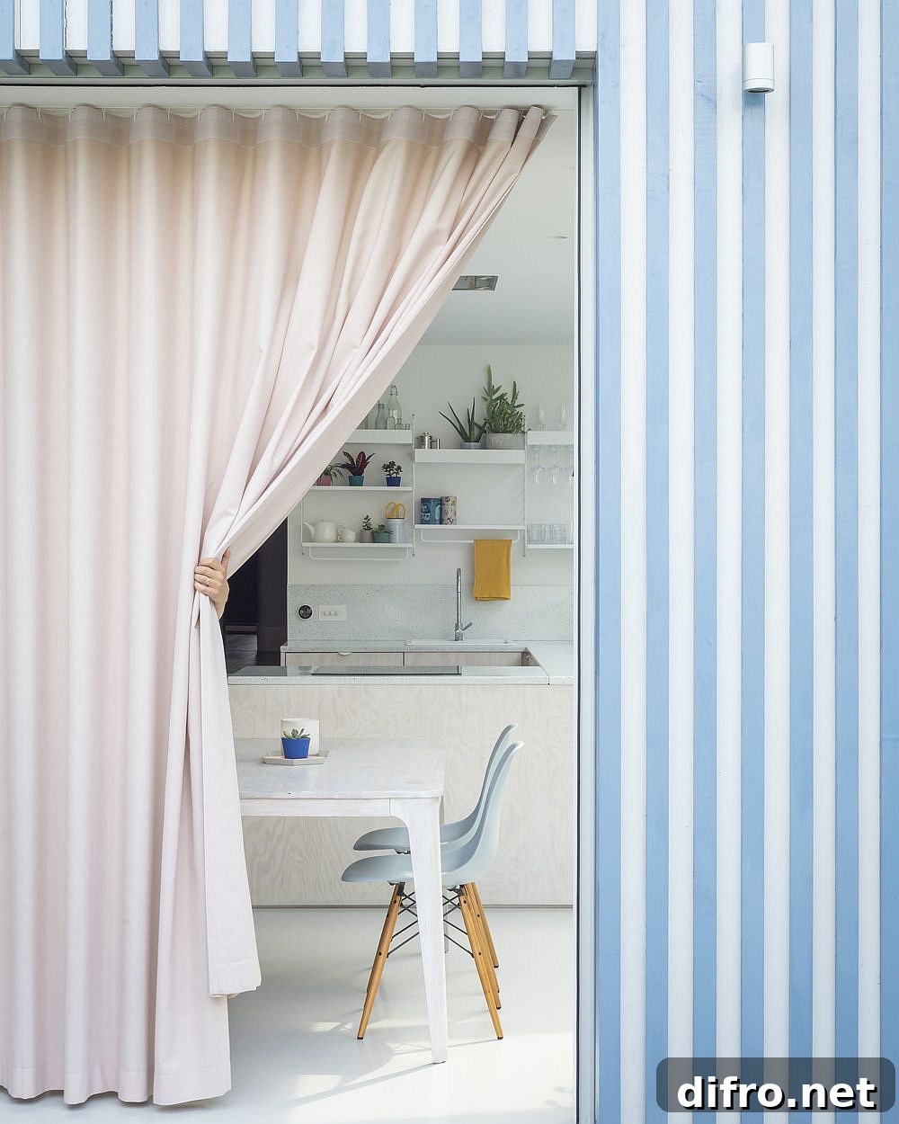 Blue and white striped timber extension along with pastel pink curtain