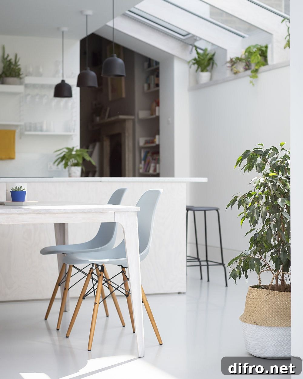 Dark gray pendant lights stand out visually thanks to the beautiful white backdrop