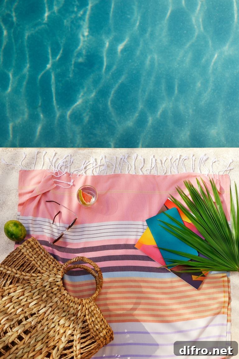 Palm leaf on poolside towel