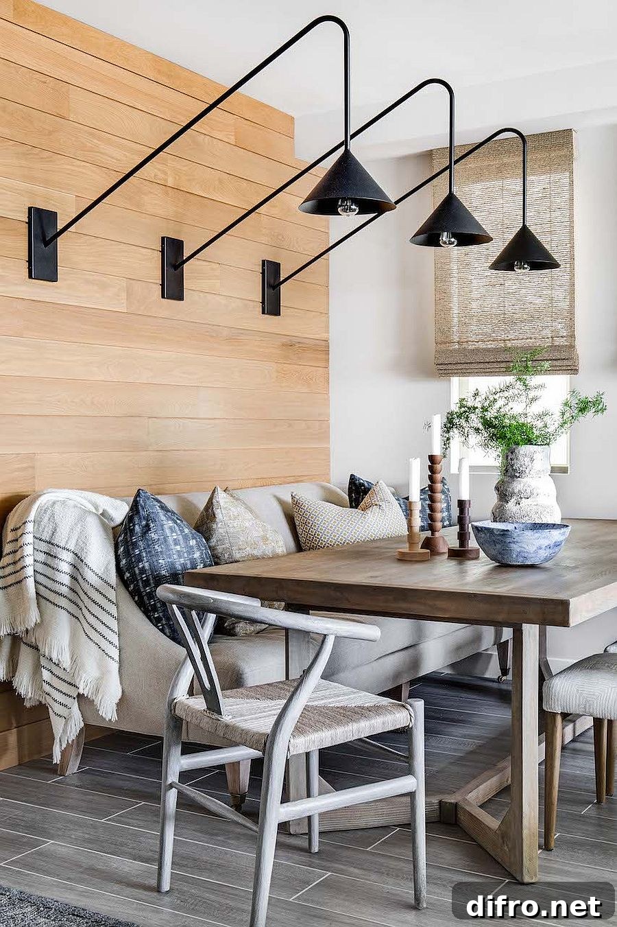 Dark sconce lighting in beach-style dining
