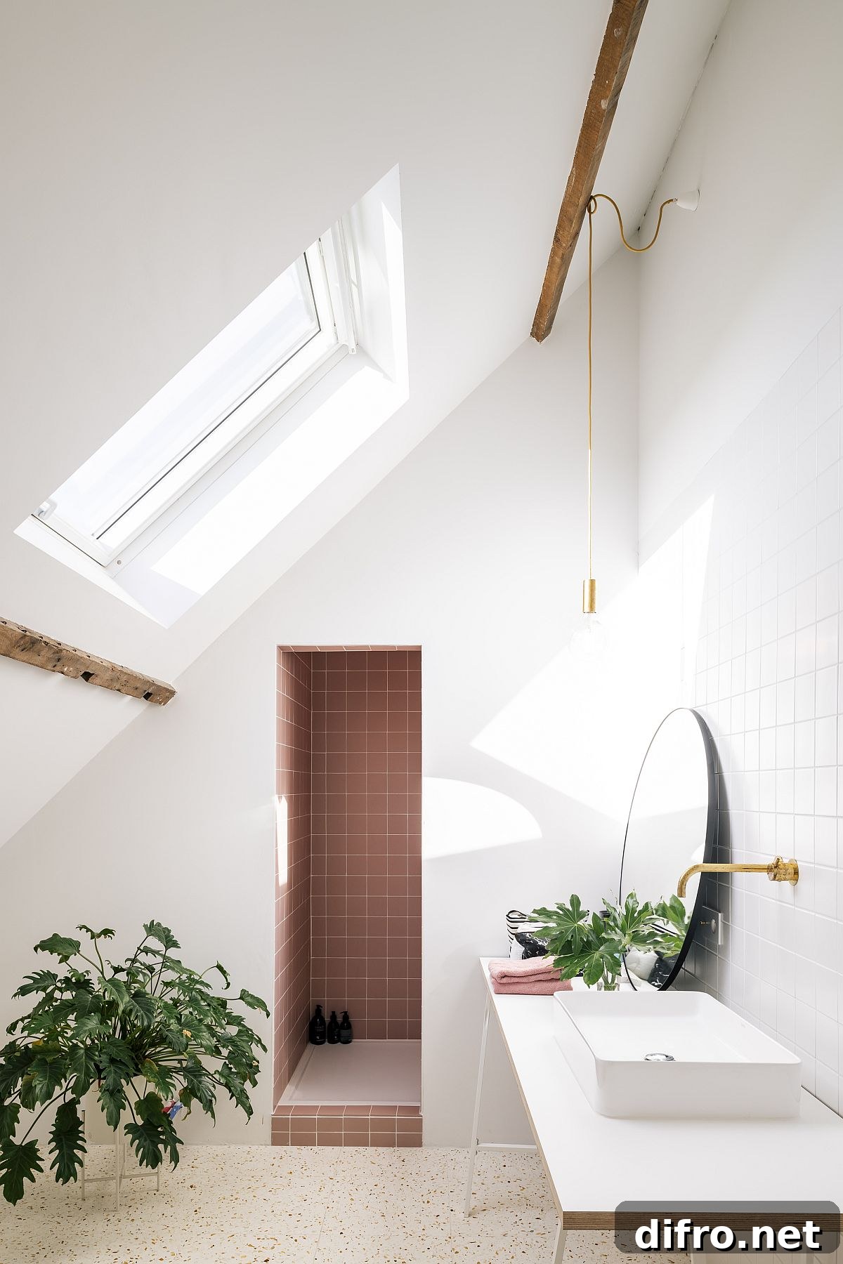 Beautiful window brings natural light into the bathroom with white walls and tiled shower area