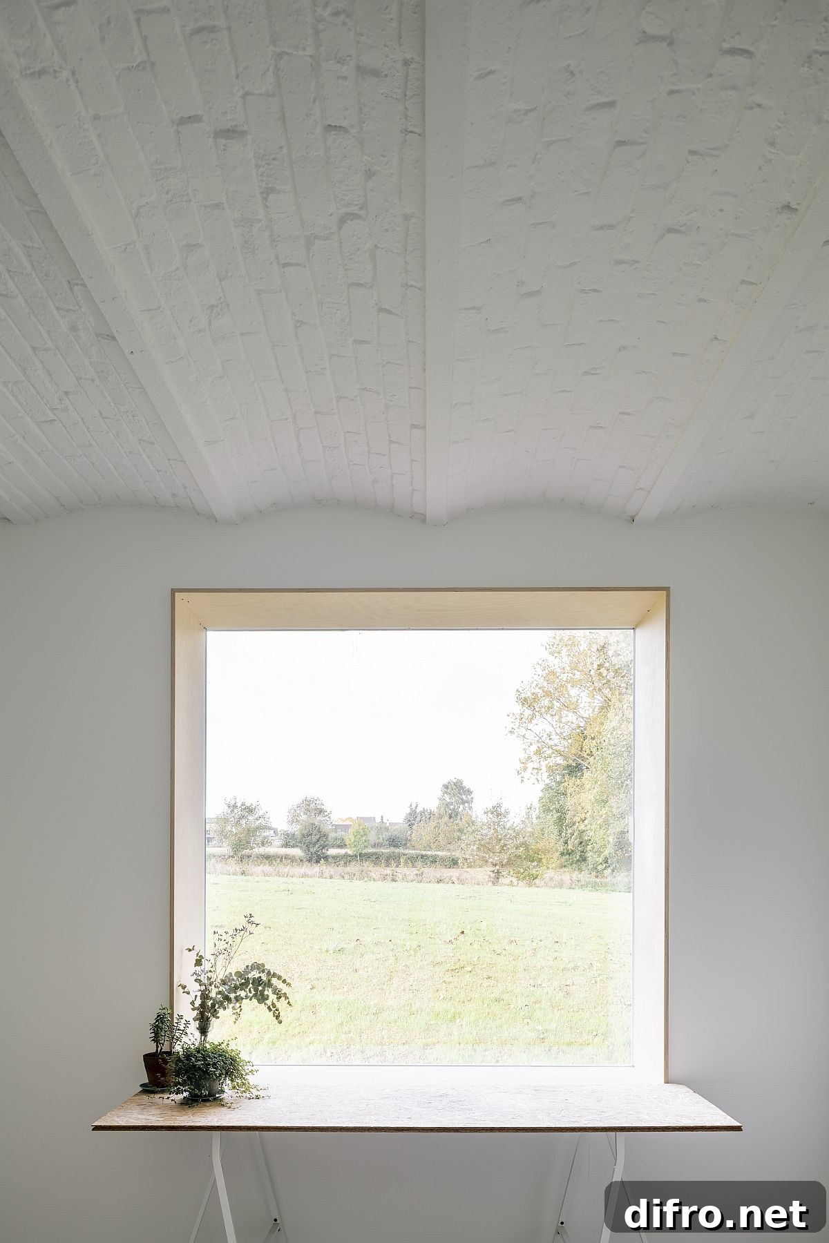 Large windows and opening bring natural light into the renovated Belgian home