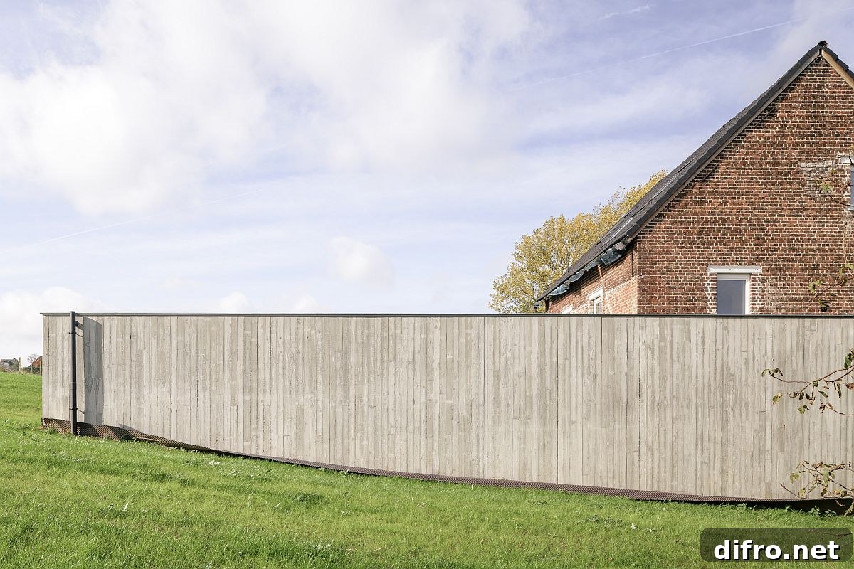 Lovely wood wall offers privacy for those inside the new extension