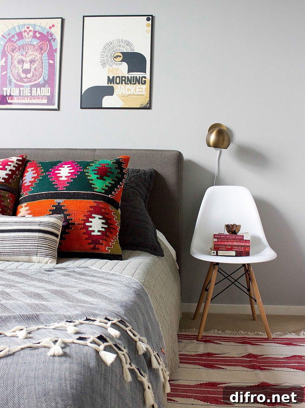 Bedroom with white bedside chair and balanced colors