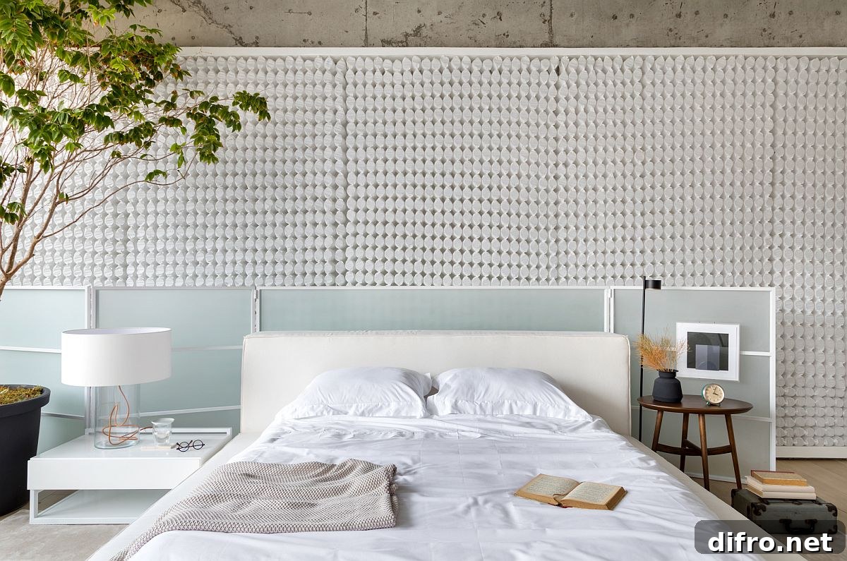 Backlit panel made of encased coils adds to the exceptional design of this bedroom