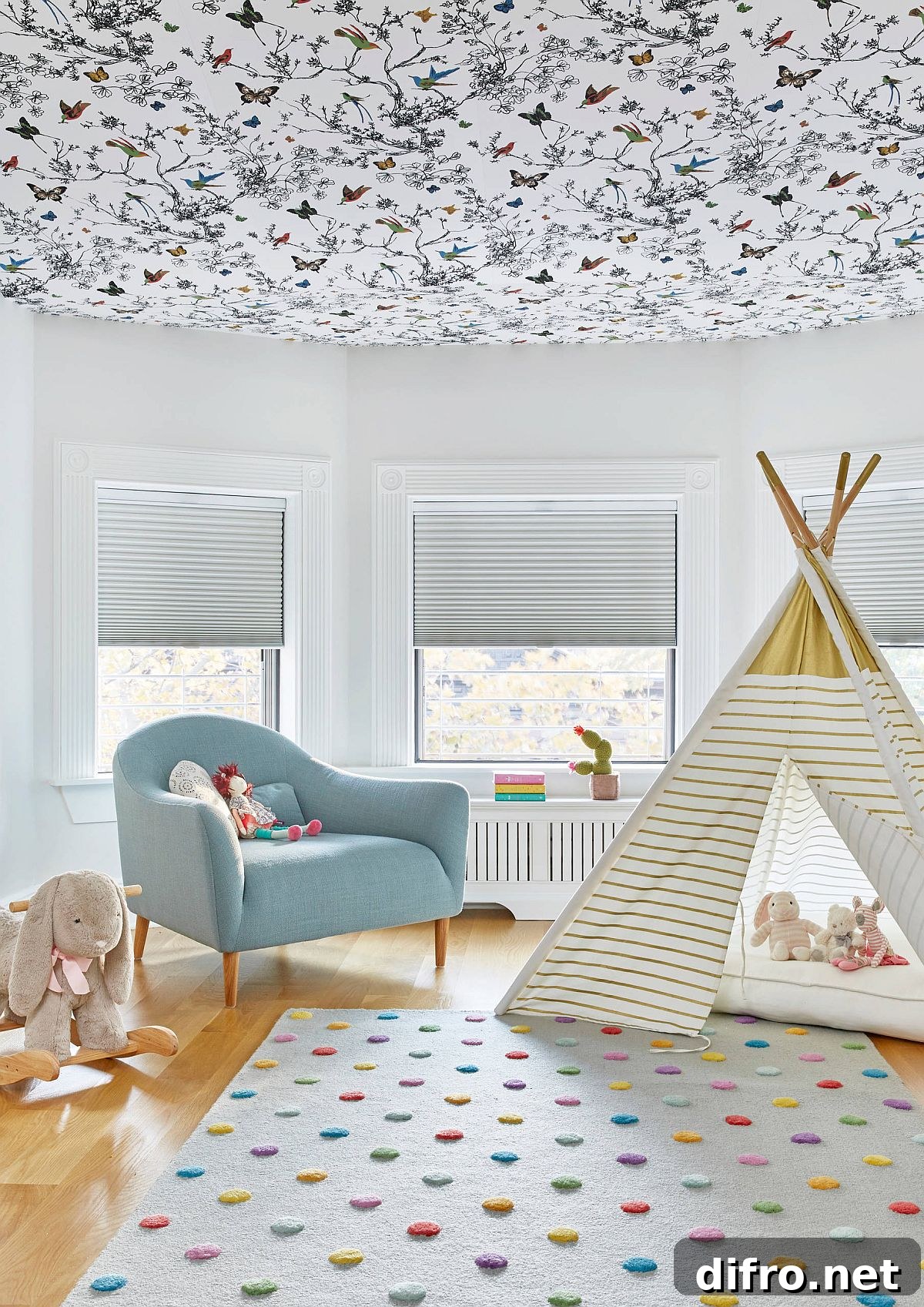 Butterfly and bird wallpaper filling a girl's room ceiling with fun pattern