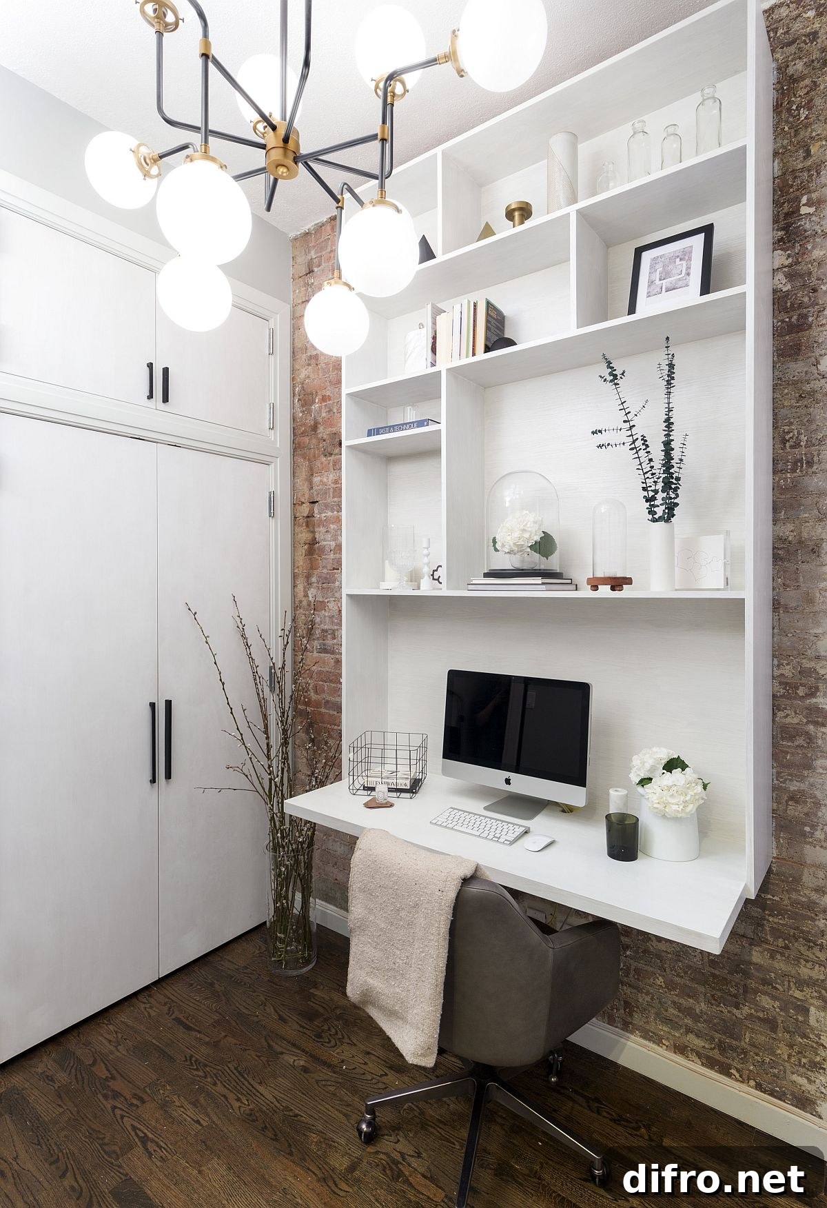 Space-savvy home office with custom white wall unit
