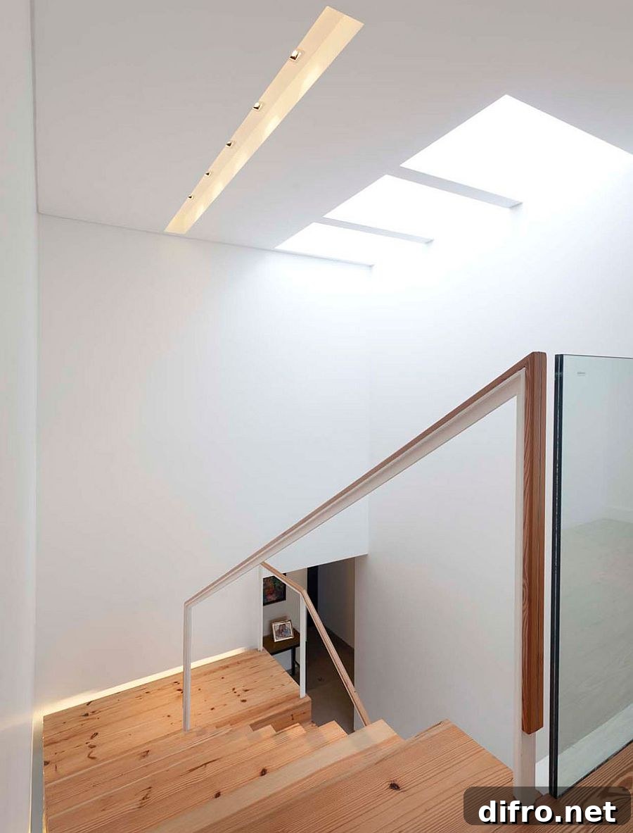 Natural light makes its way into the stairwell thanks to a skylight
