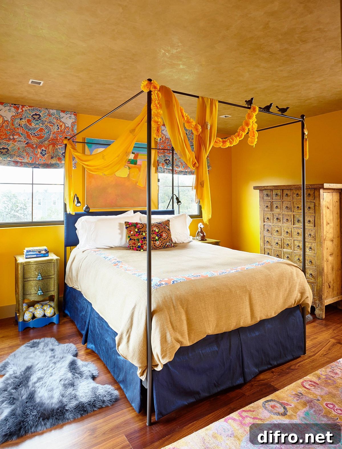Eclectic bedroom with textured yellow ceiling and blue accents