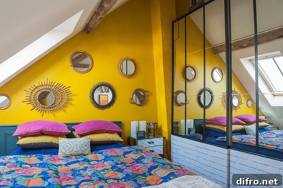 Small Mediterranean attic bedroom with yellow accent wall and blue bedding