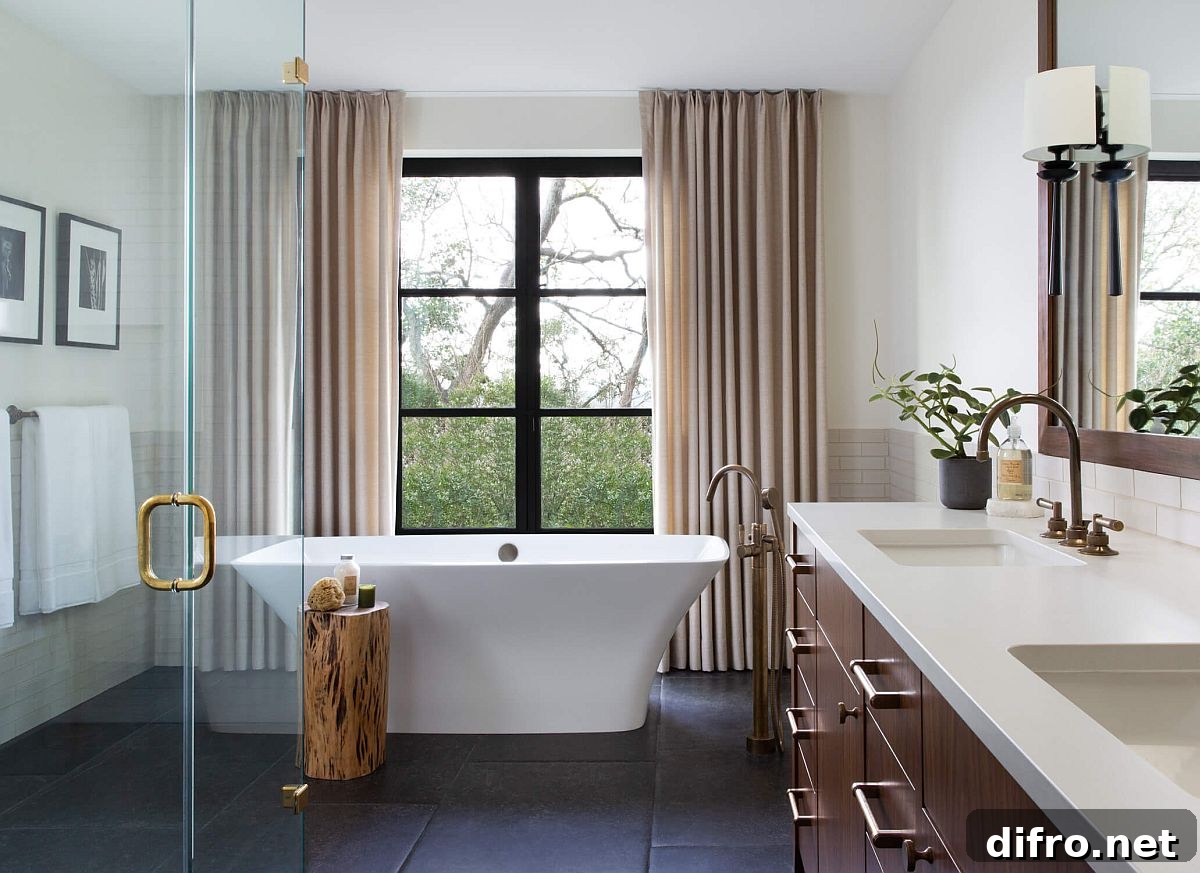 Dark framed glass windows turn the tree outside into a work of art that changes with changing seasons