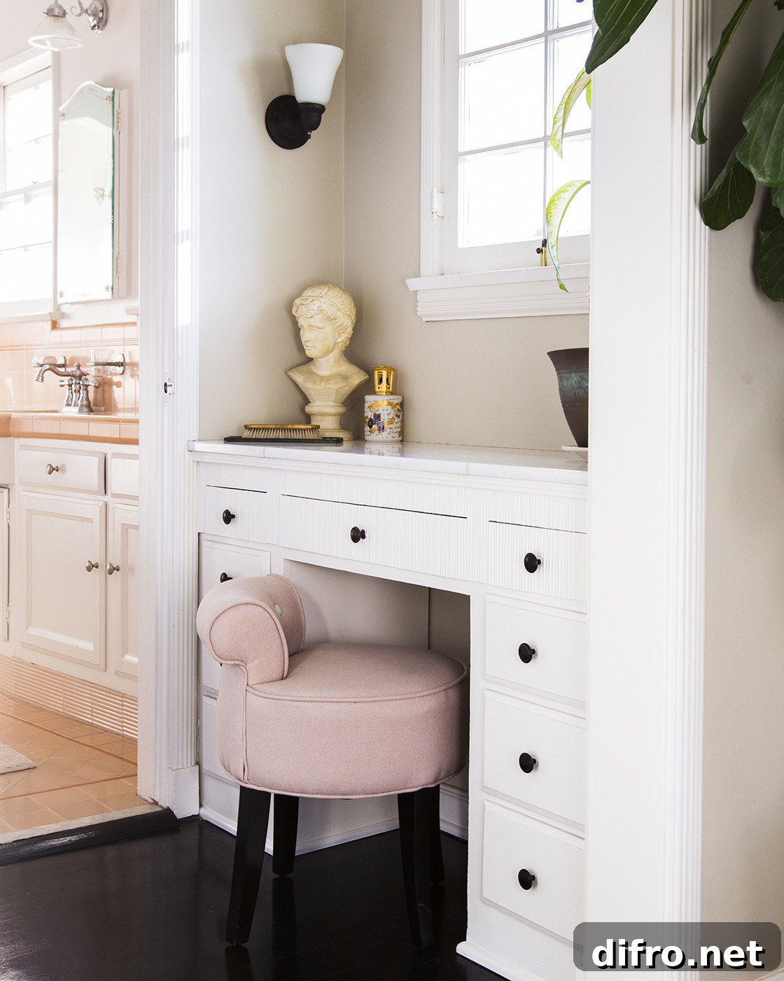 Built-in vanity area with a cushioned stool