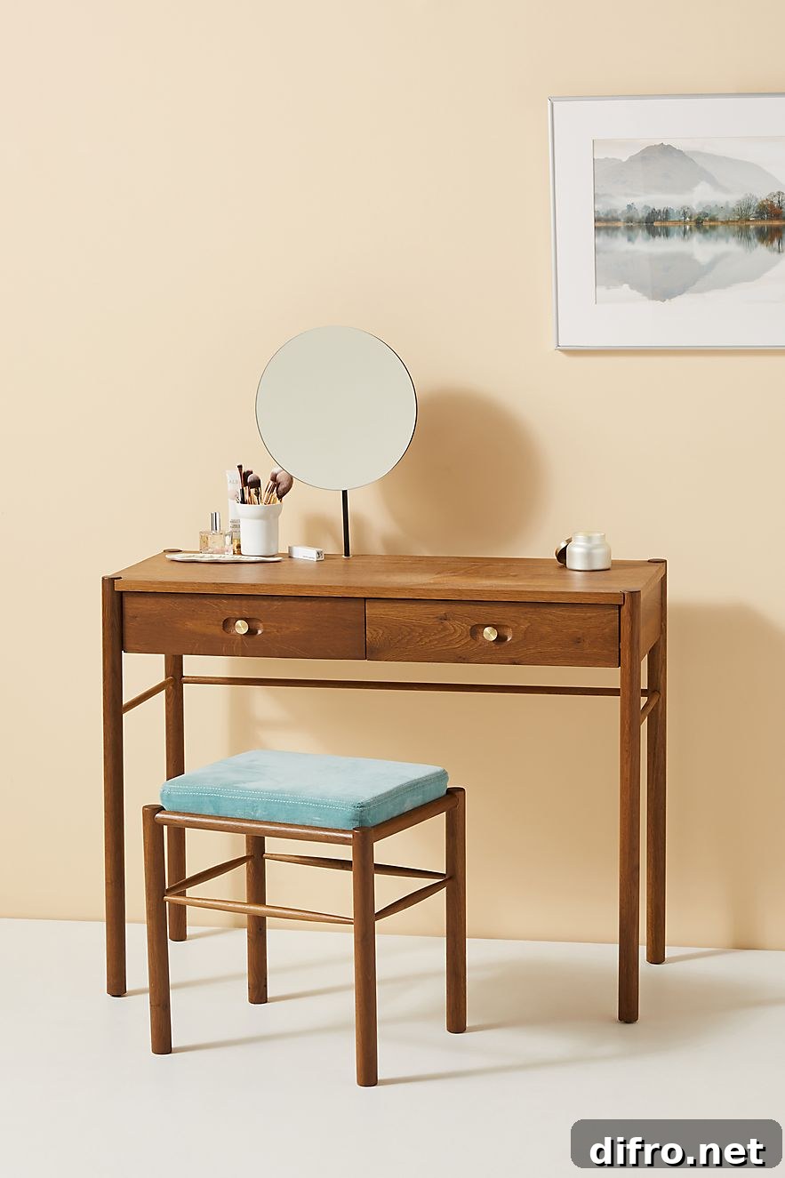 Wooden dressing table with clean lines and brass hardware