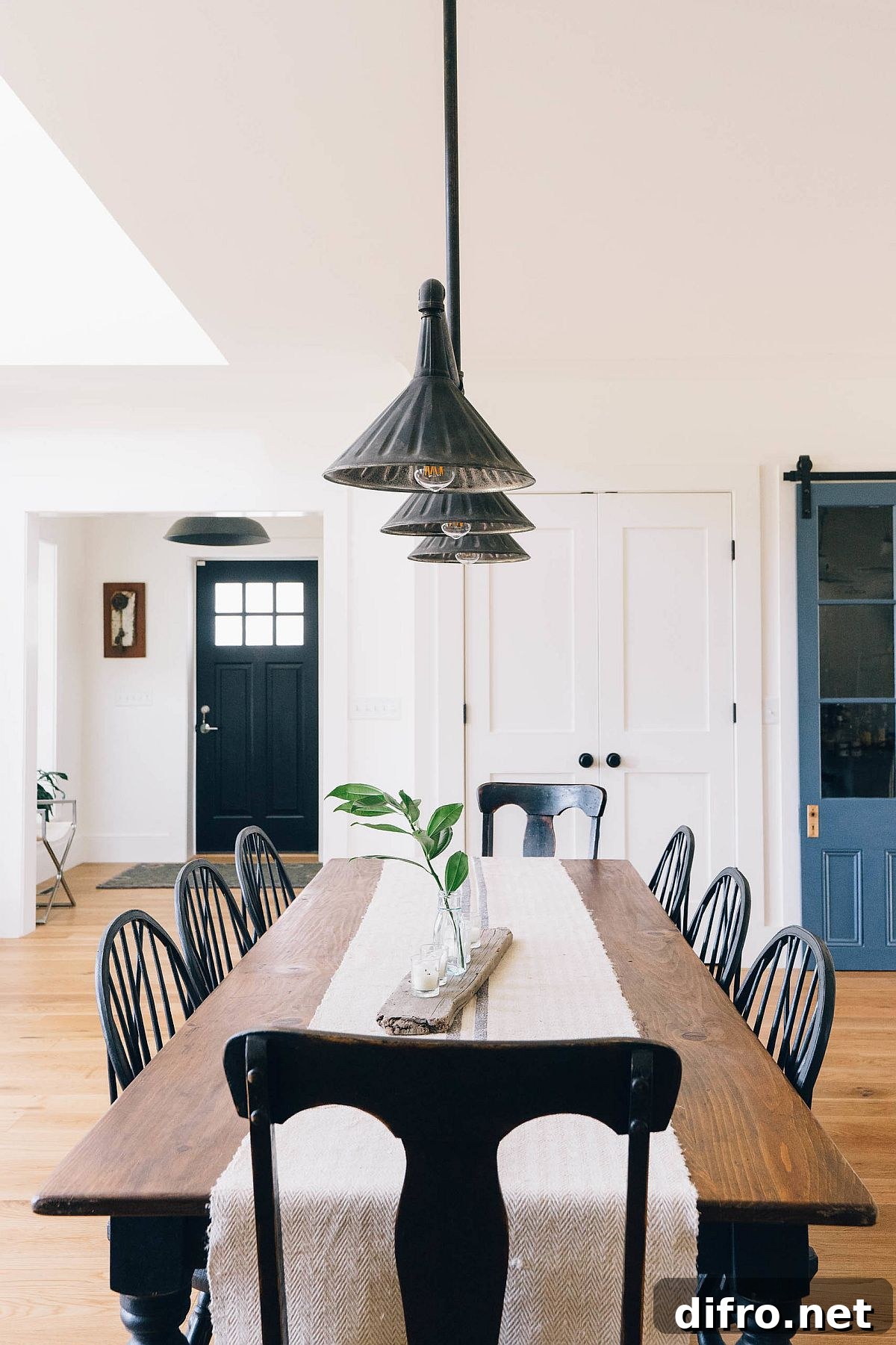 Dining area with pendant light and large wooden table