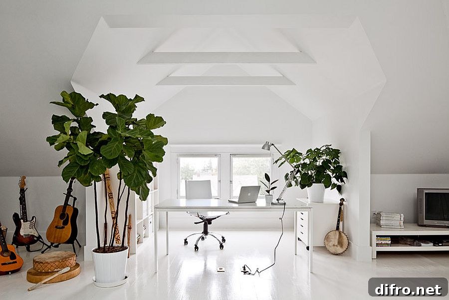 Gorgeous attic home office in white with indoor plants and plenty of freshness [Design: Jessica Helgerson Interior Design]