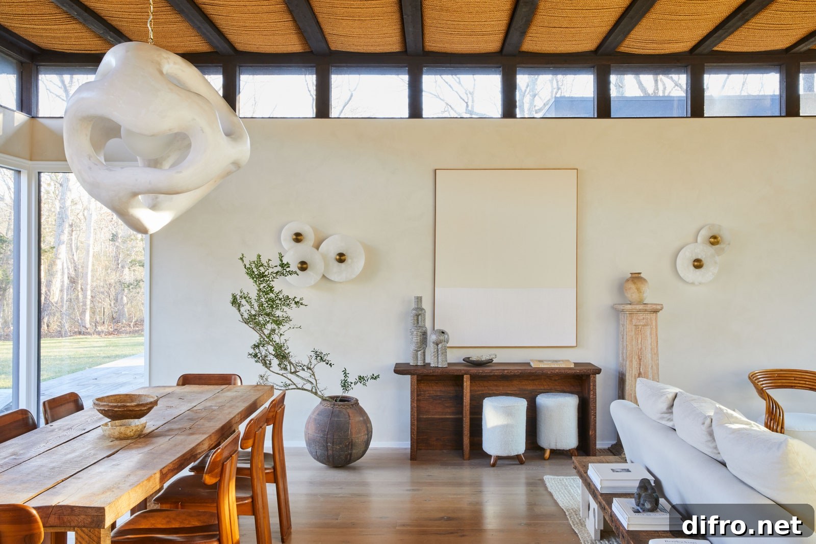 Dining room with sculptural sconces