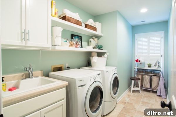 Ergonomic laundry room design with beautiful white shelves