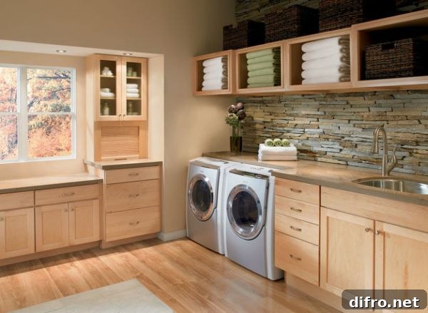 Beautiful laundry room with ample storage and shelving