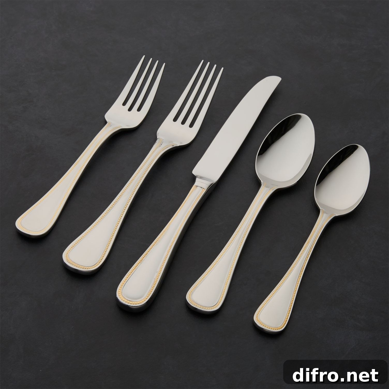 Grand Hotel flatware with gold-toned beaded border