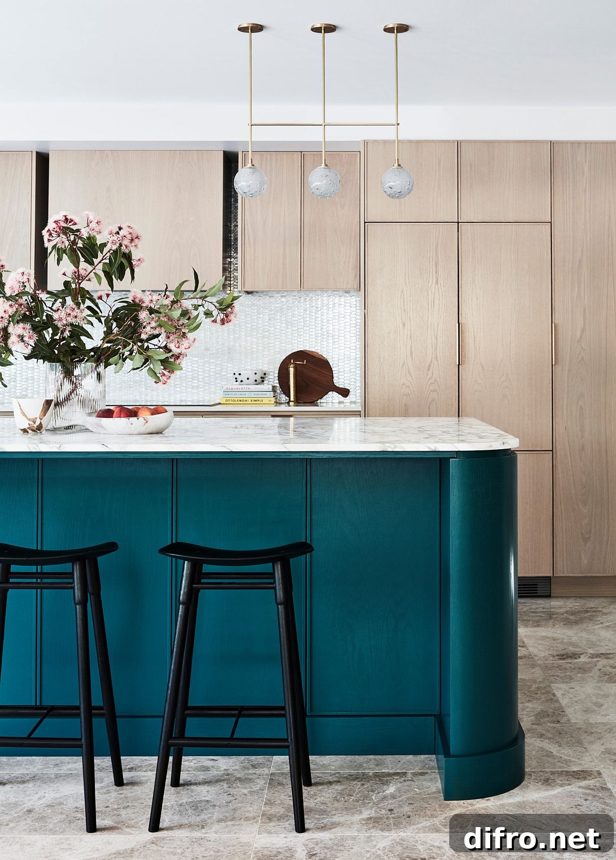 Turquoise kitchen island with marble countertops
