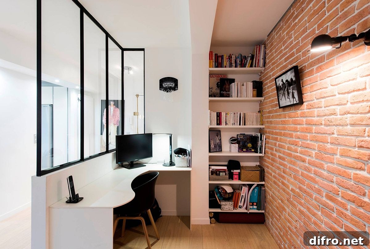 Curvy desk with exposed brick wall