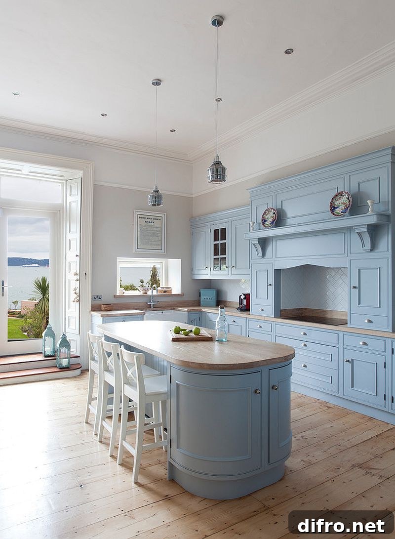 Farmhouse kitchen with light blue cabinets and island