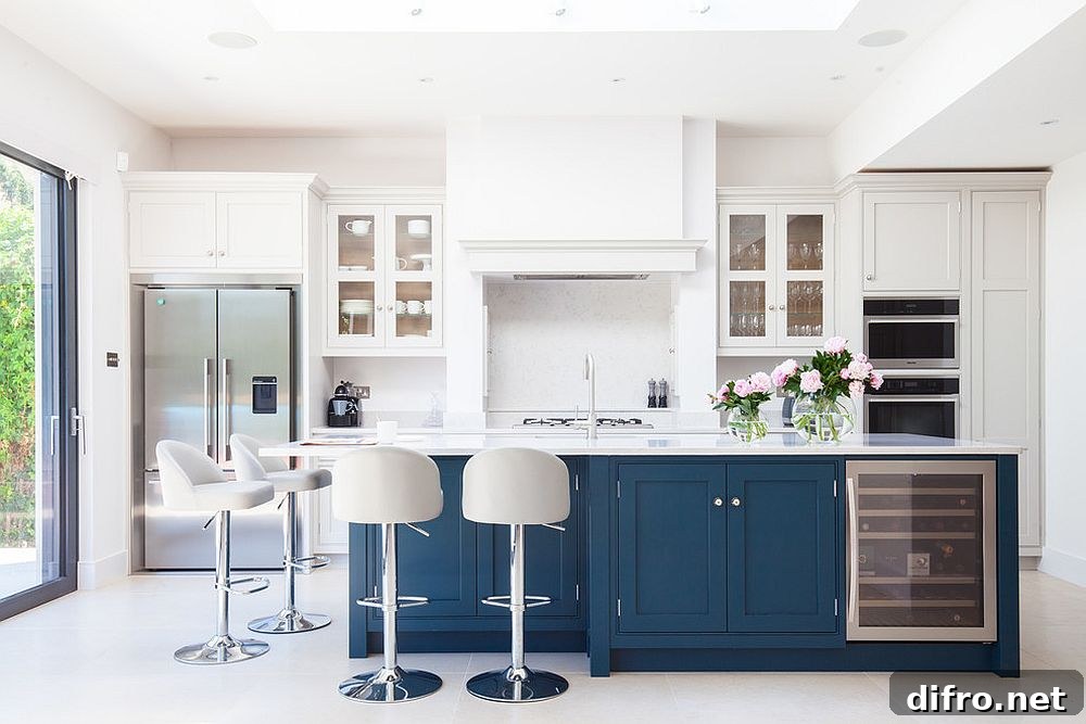 White kitchen with navy-blue island