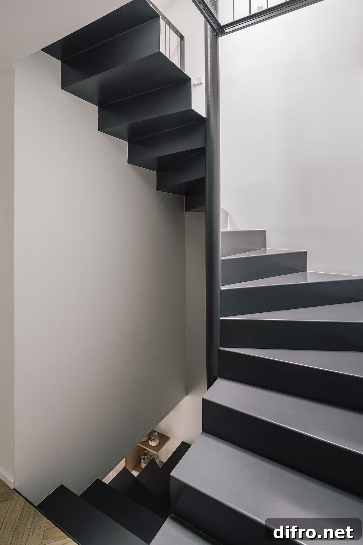 Lovely and space-savvy staircase in gray and white connects the various levels inside the house