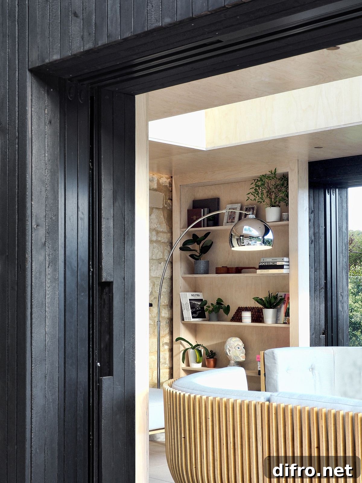 Timber bookcases conceal glass walls