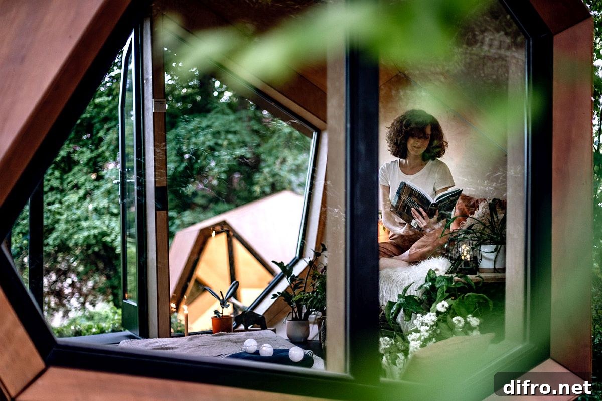 Glass walls connect the cabin interior to the exterior landscape