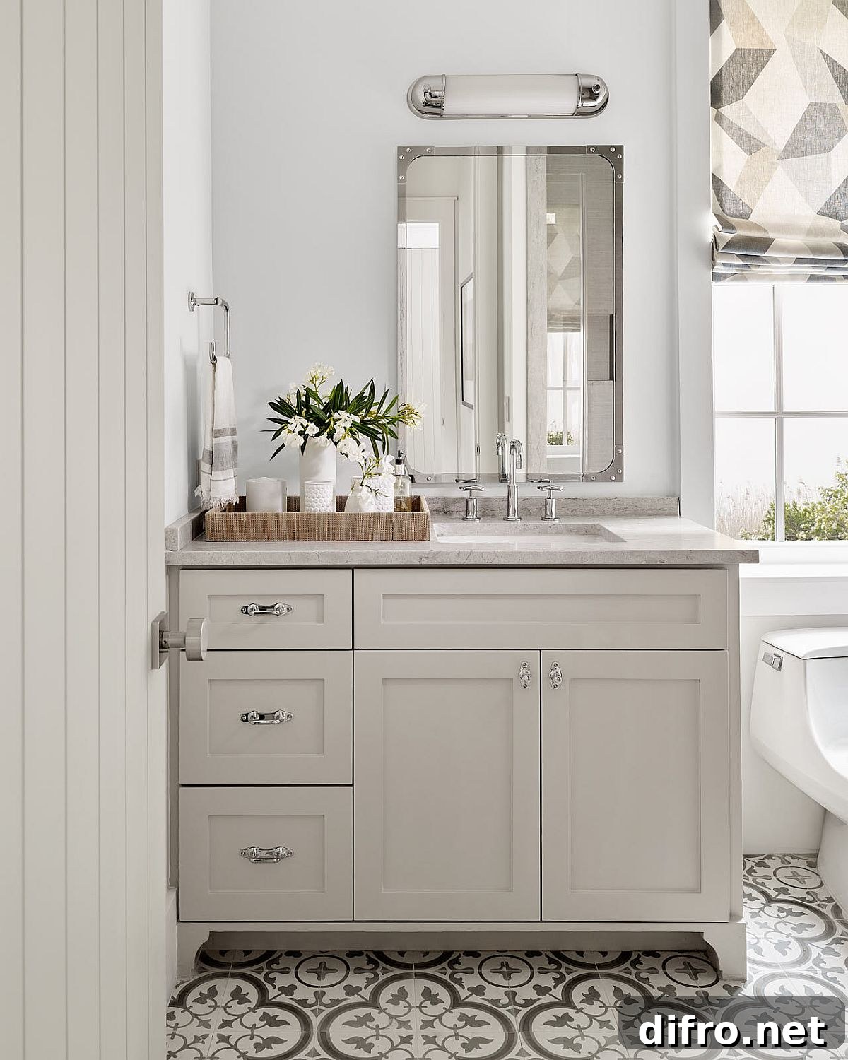 Tiles add pattern to the beach style bathroom without altering its color scheme