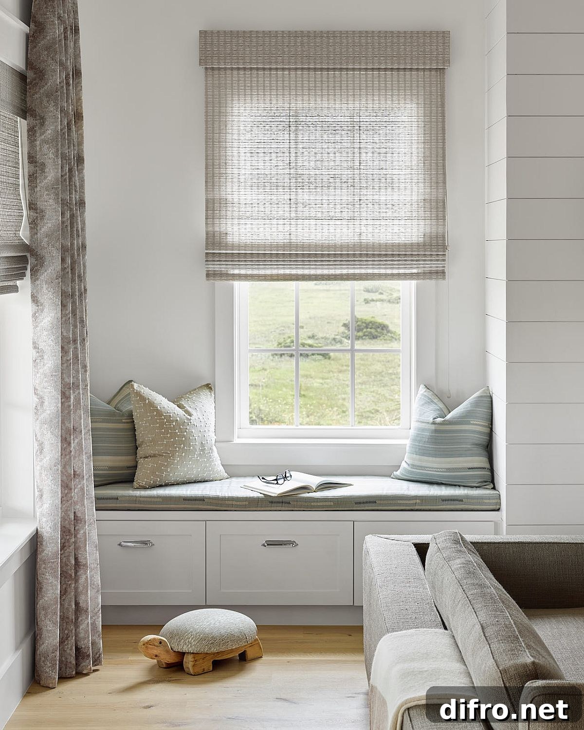 Custom built-in window seat adds to the options in the living room