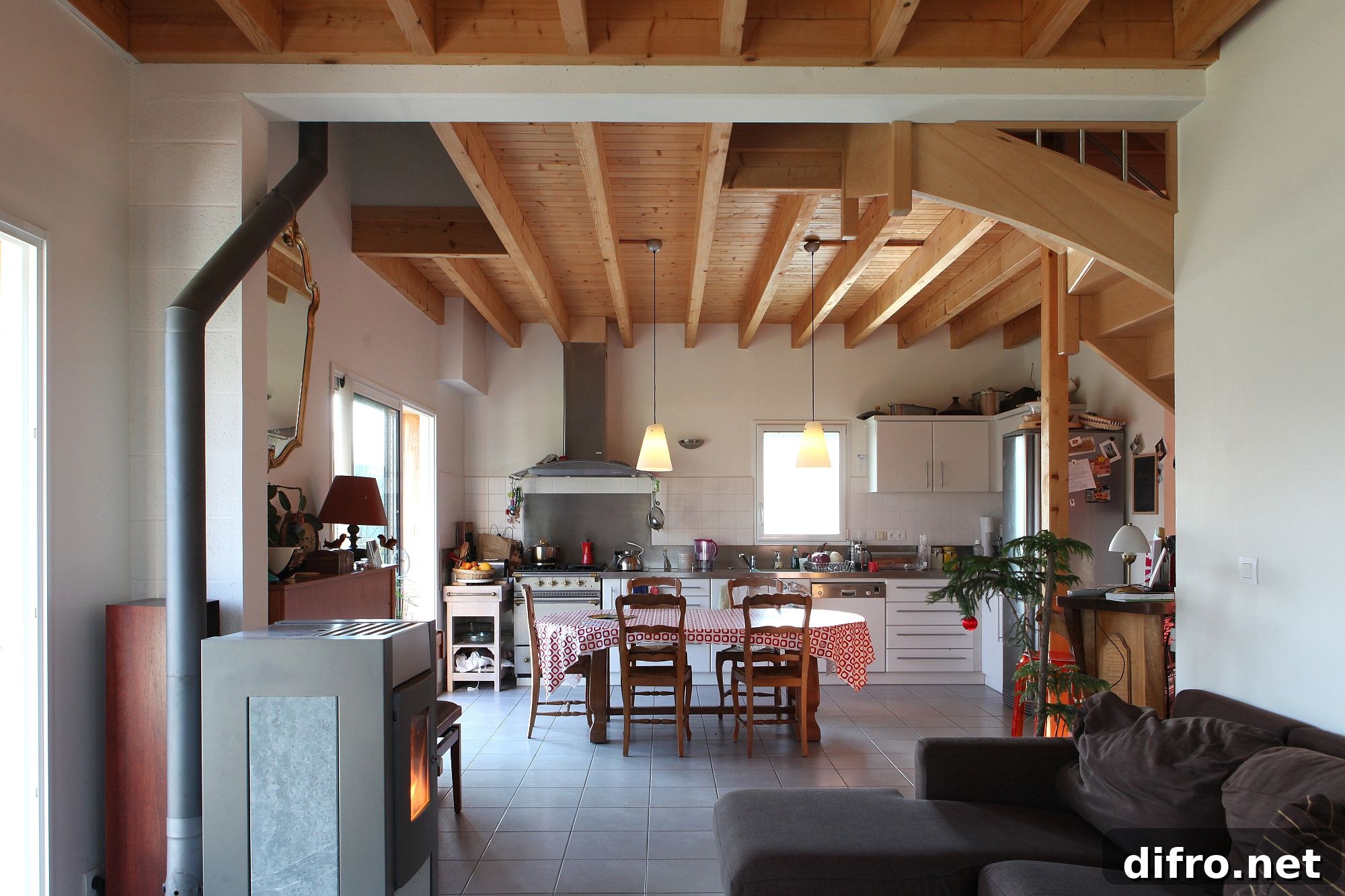 Social dining area and kitchen with a vernacular cabin look
