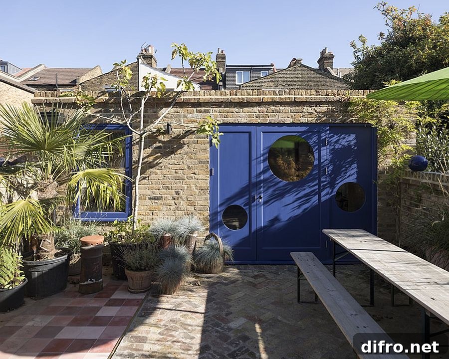 Garden studio with blue door and windows
