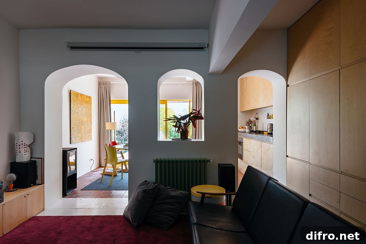 Living room with purple rug and yellow accents