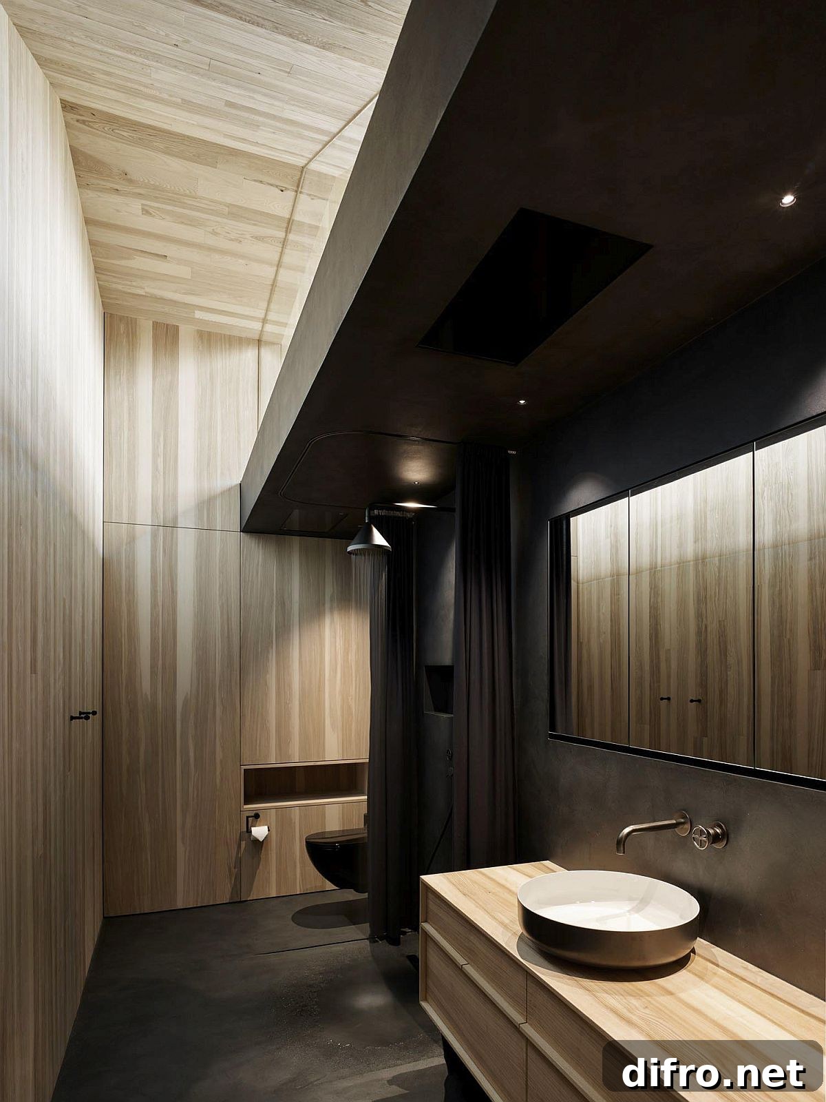 Bathroom featuring wood cladding and darker fixtures for a contemporary look