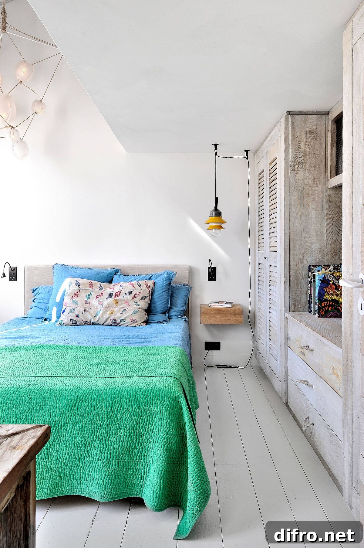 Monochromatic Paris bedroom with colorful bedding