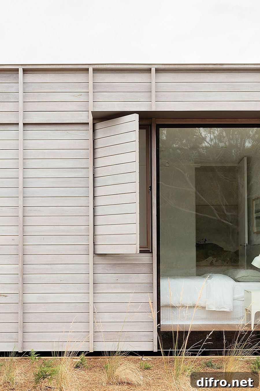Sliding screens and windows open up to connect the interior with the landscape outside