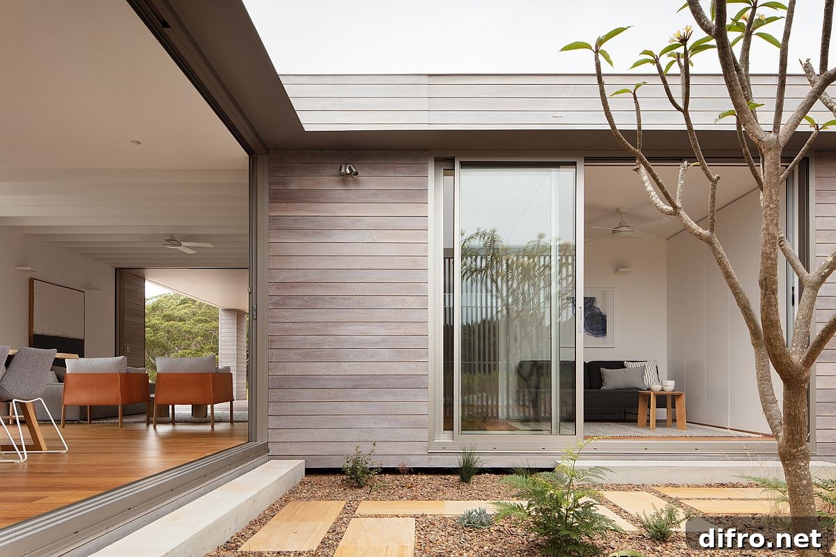 Central courtyard of the prefab becomes an integral part of the living area and the bedrooms next to it